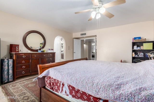 tiled bedroom with ceiling fan