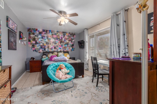 bedroom with ceiling fan and light tile floors