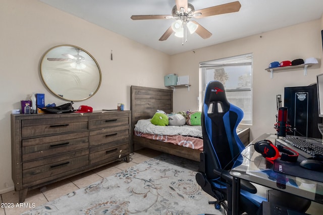 bedroom featuring light tile floors and ceiling fan