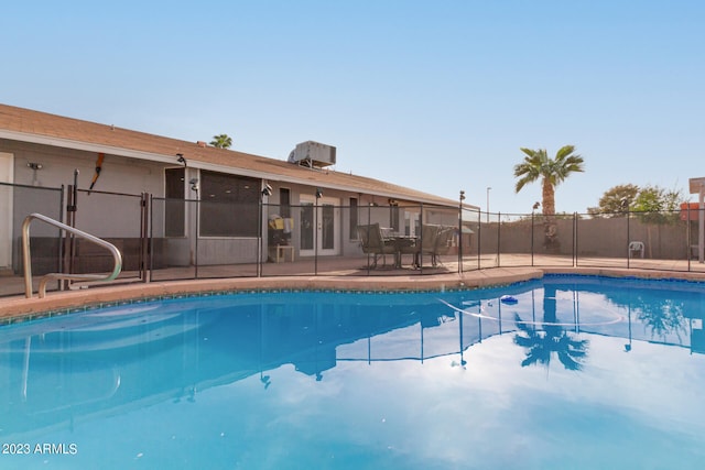 view of swimming pool with a patio