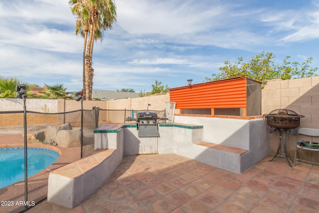 view of terrace with a fenced in pool