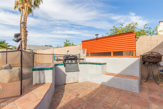 view of patio / terrace with a fire pit