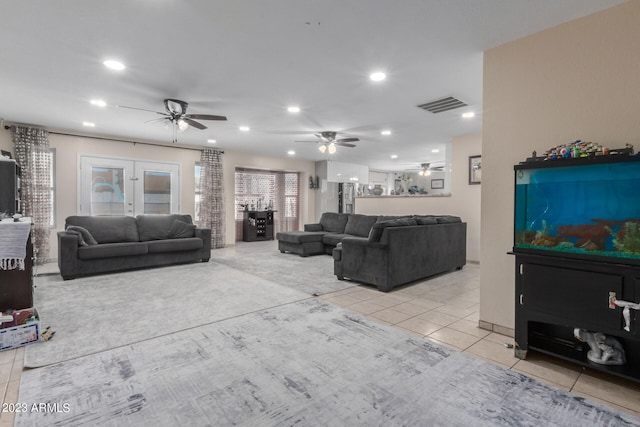 living room with ceiling fan and french doors