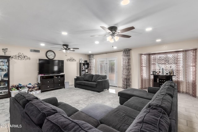 living room with french doors and ceiling fan