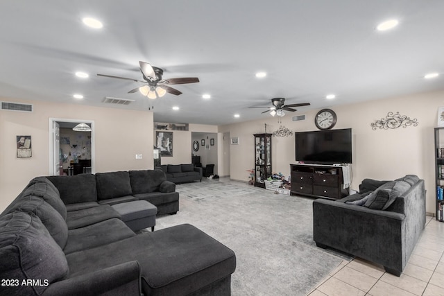 tiled living room featuring ceiling fan