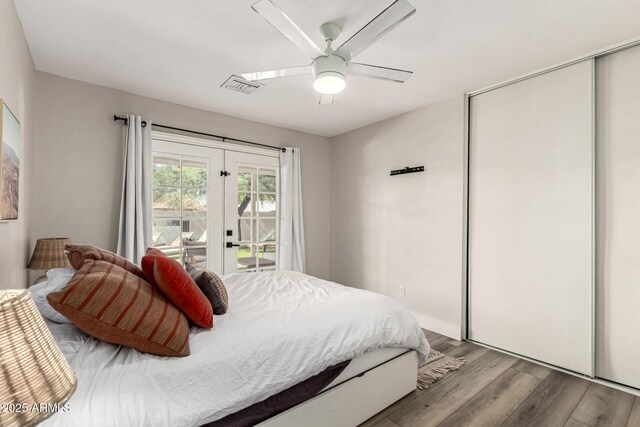 7440 E Hubbell St, Scottsdale, AZ 85257 - bedroom with wood finished floors, access to outside, a closet, and a ceiling fan