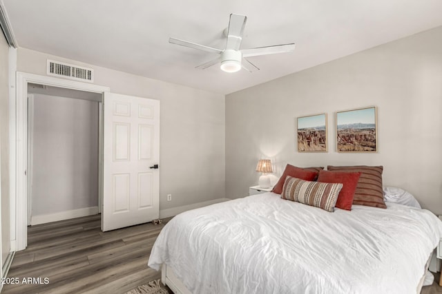 7440 E Hubbell St, Scottsdale, AZ 85257 - bedroom featuring wood finished floors and a ceiling fan