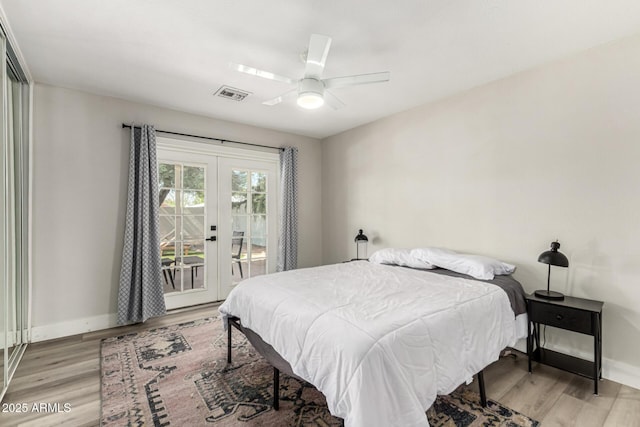 7440 E Hubbell St, Scottsdale, AZ 85257 - bedroom featuring access to exterior, light wood-style floors, french doors, and ceiling fan
