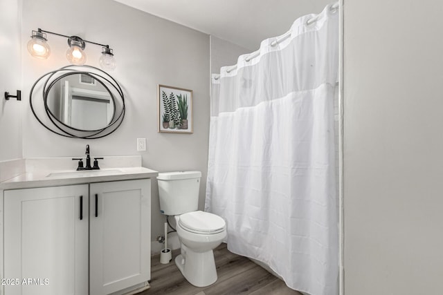 7440 E Hubbell St, Scottsdale, AZ 85257 - bathroom with wood finished floors, vanity, and curtained shower