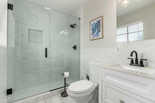 7440 E Hubbell St, Scottsdale, AZ 85257 - bathroom featuring marble finish floors, a marble finish shower, tile walls, and vanity