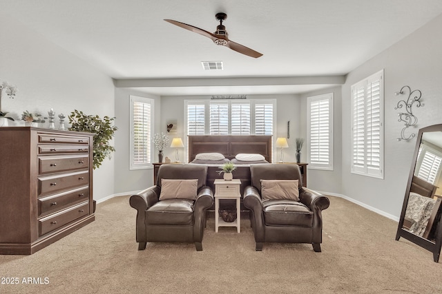 bedroom featuring light carpet and ceiling fan