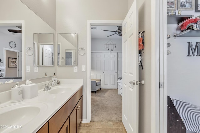 bathroom featuring tile patterned flooring and vanity