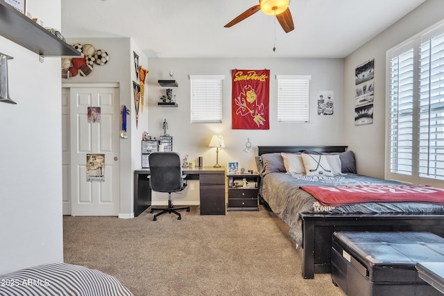 carpeted bedroom featuring ceiling fan