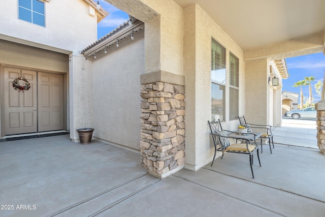 property entrance with covered porch