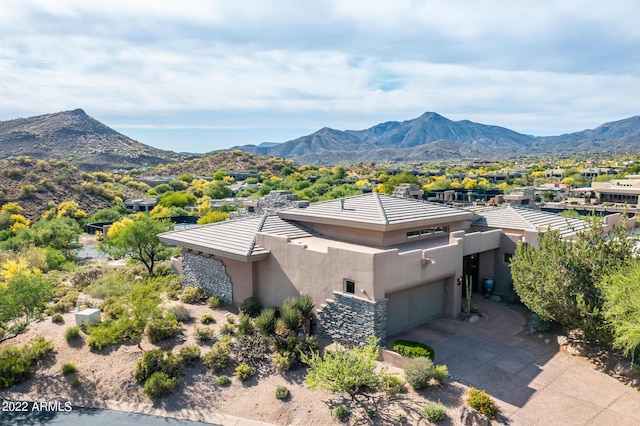 birds eye view of property with a mountain view