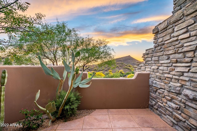 view of patio terrace at dusk