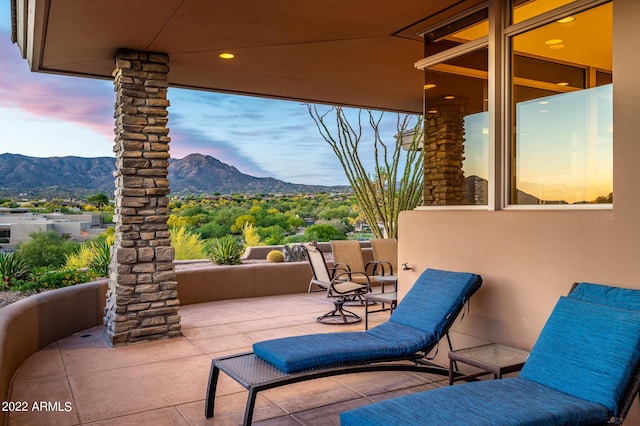 patio terrace at dusk with a mountain view