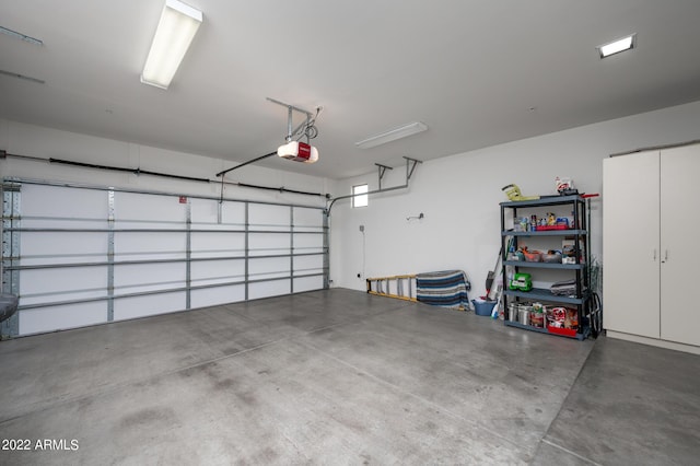 garage featuring a garage door opener