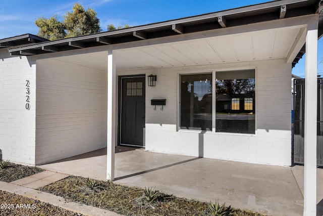 property entrance with a patio