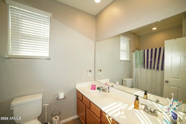 19886 W Woodlands Ave, Buckeye, AZ 85326 - full bath featuring toilet, a shower with curtain, double vanity, and recessed lighting