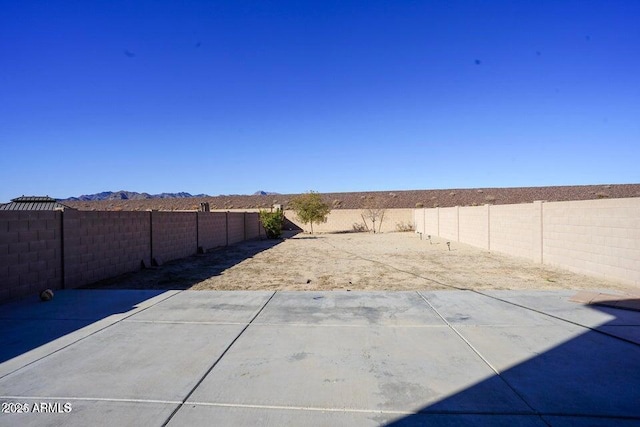 19886 W Woodlands Ave, Buckeye, AZ 85326 - fenced backyard featuring a patio