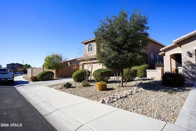 19886 W Woodlands Ave, Buckeye, AZ 85326 - view of front facade with stucco siding and a residential view