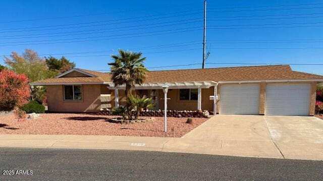 ranch-style house featuring a garage