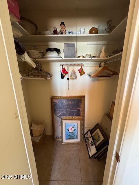 walk in closet featuring tile patterned flooring