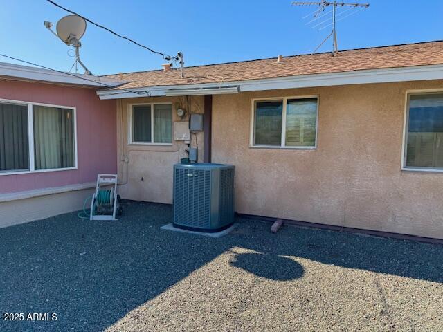 doorway to property featuring central AC unit