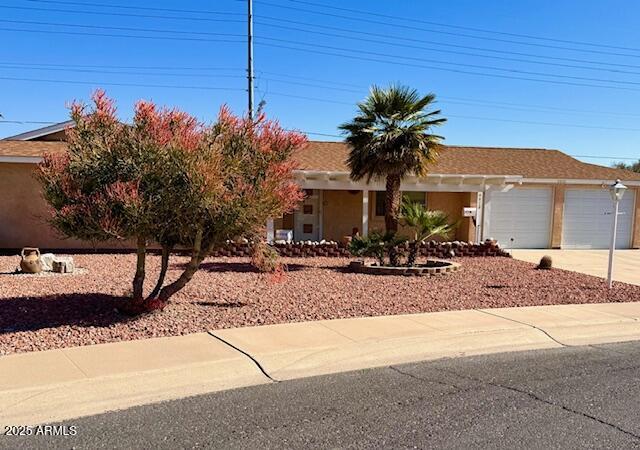 ranch-style home with a garage