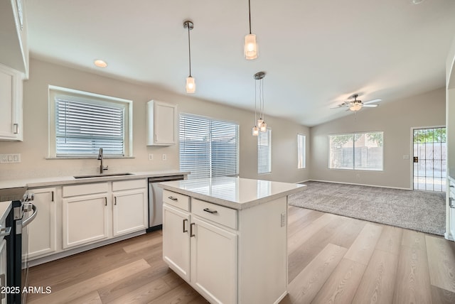 12333 W Marshall Ave, Litchfield Park, AZ 85340 - kitchen with a sink, appliances with stainless steel finishes, a ceiling fan, light wood finished floors, and vaulted ceiling