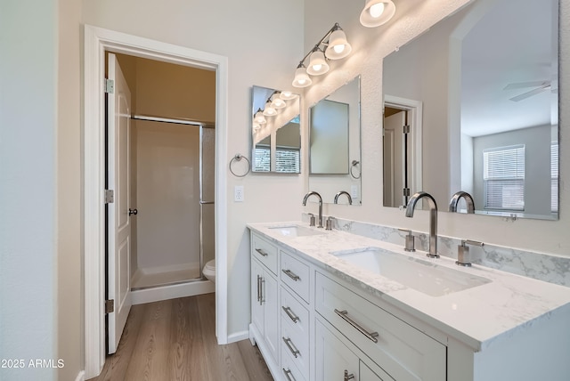12333 W Marshall Ave, Litchfield Park, AZ 85340 - full bath featuring a sink, a shower with door, double vanity, and wood finished floors