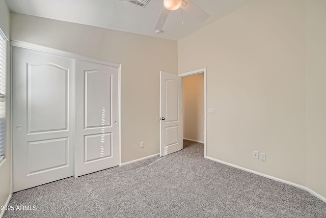12333 W Marshall Ave, Litchfield Park, AZ 85340 - unfurnished bedroom with carpet floors, baseboards, a ceiling fan, and lofted ceiling