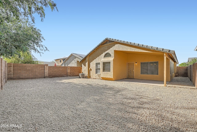 12333 W Marshall Ave, Litchfield Park, AZ 85340 - back of property with cooling unit, a fenced backyard, stucco siding, and a patio area