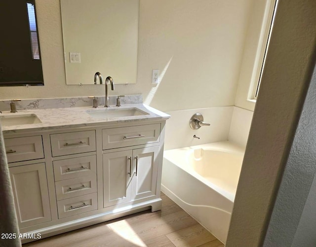 12333 W Marshall Ave, Litchfield Park, AZ 85340 - full bath featuring a bath, wood finished floors, double vanity, and a sink