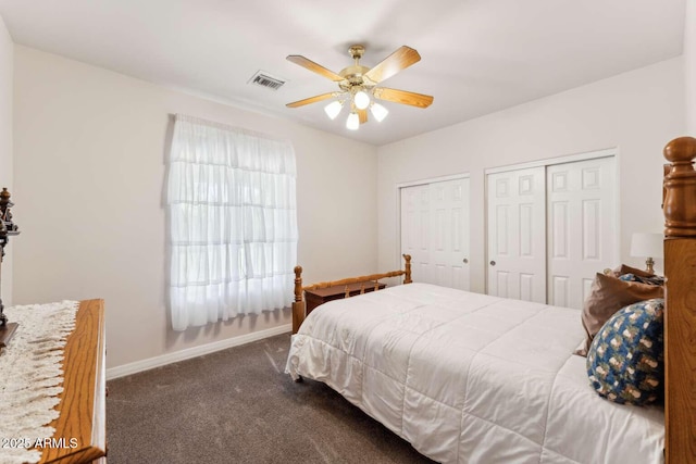 3750 E Palm St, Mesa, AZ 85215 - bedroom with dark colored carpet, two closets, baseboards, and ceiling fan