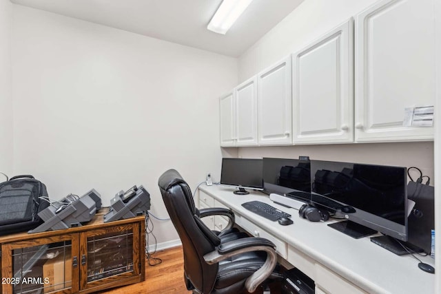3750 E Palm St, Mesa, AZ 85215 - home office featuring light wood finished floors, baseboards, and built in desk