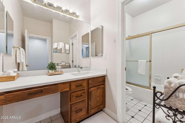3750 E Palm St, Mesa, AZ 85215 - bathroom with vanity, combined bath / shower with glass door, and toilet