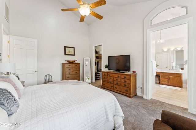 3750 E Palm St, Mesa, AZ 85215 - bedroom featuring light colored carpet, a walk in closet, high vaulted ceiling, a closet, and ensuite bath