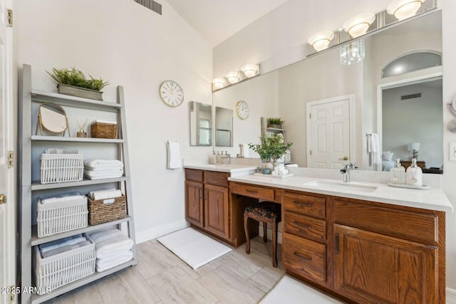 3750 E Palm St, Mesa, AZ 85215 - bathroom featuring double vanity and vaulted ceiling