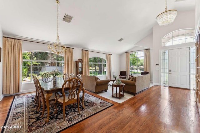 3750 E Palm St, Mesa, AZ 85215 - dining room with a chandelier, wood finished floors, baseboards, and high vaulted ceiling