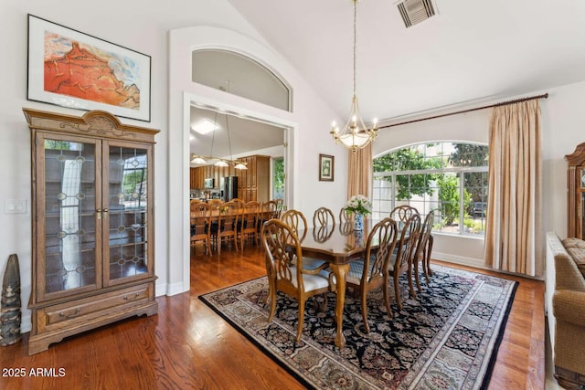 3750 E Palm St, Mesa, AZ 85215 - dining space with a chandelier, wood finished floors, and lofted ceiling