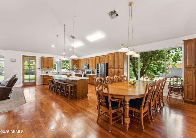 3750 E Palm St, Mesa, AZ 85215 - dining space featuring wood finished floors and high vaulted ceiling