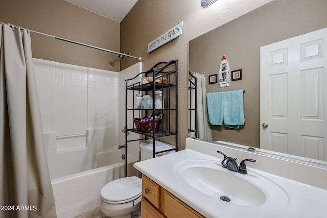 full bathroom with vanity, shower / bath combo, and toilet