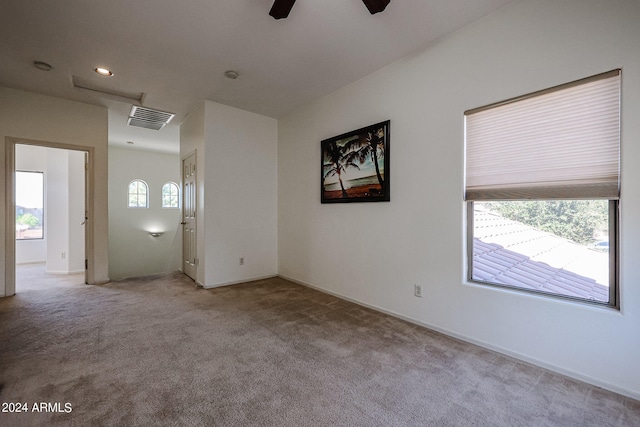 carpeted empty room with ceiling fan