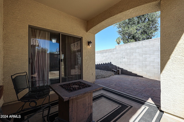 view of patio / terrace with a fire pit