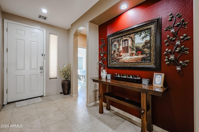 entryway featuring light tile patterned floors