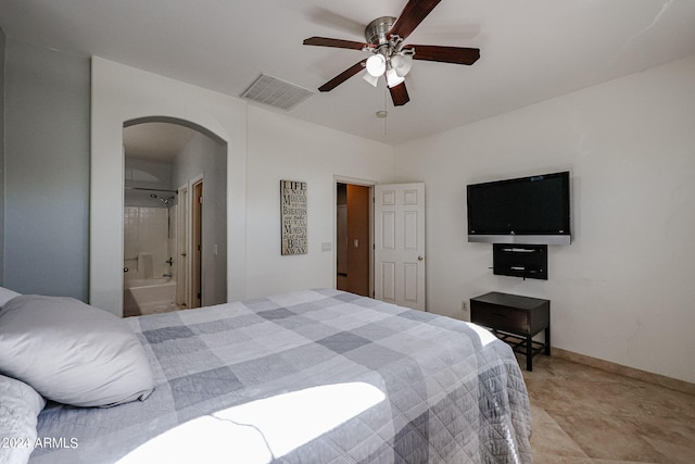 bedroom with ensuite bathroom and ceiling fan