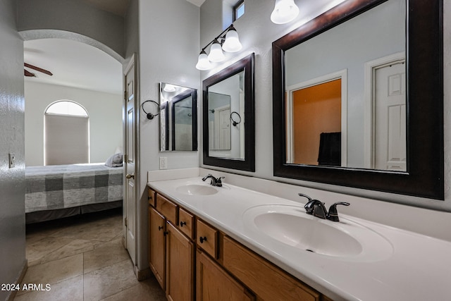 bathroom featuring vanity, tile patterned flooring, and ceiling fan