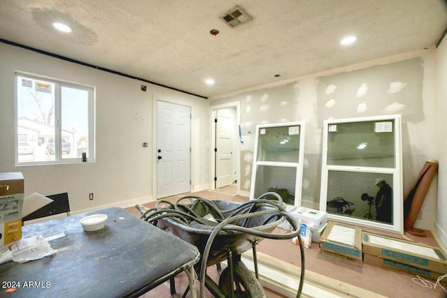 dining room with a textured ceiling